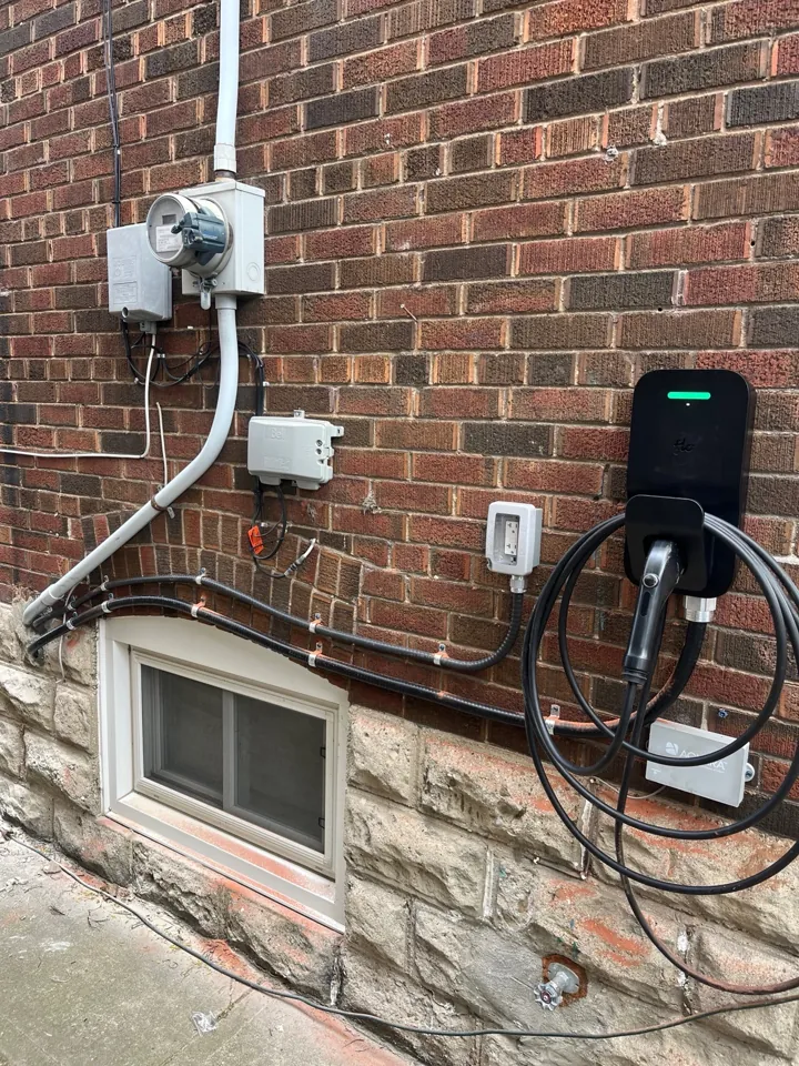 FLO charger on an exterior brick wall