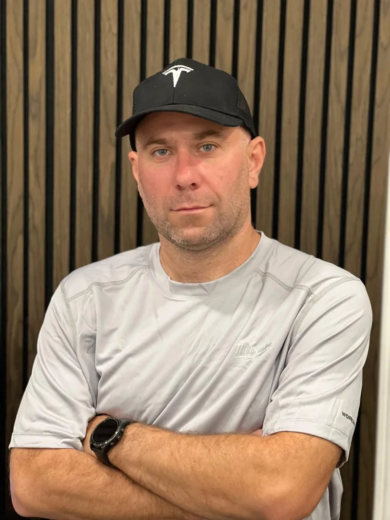 Yaroslav wearing a Tesla cap